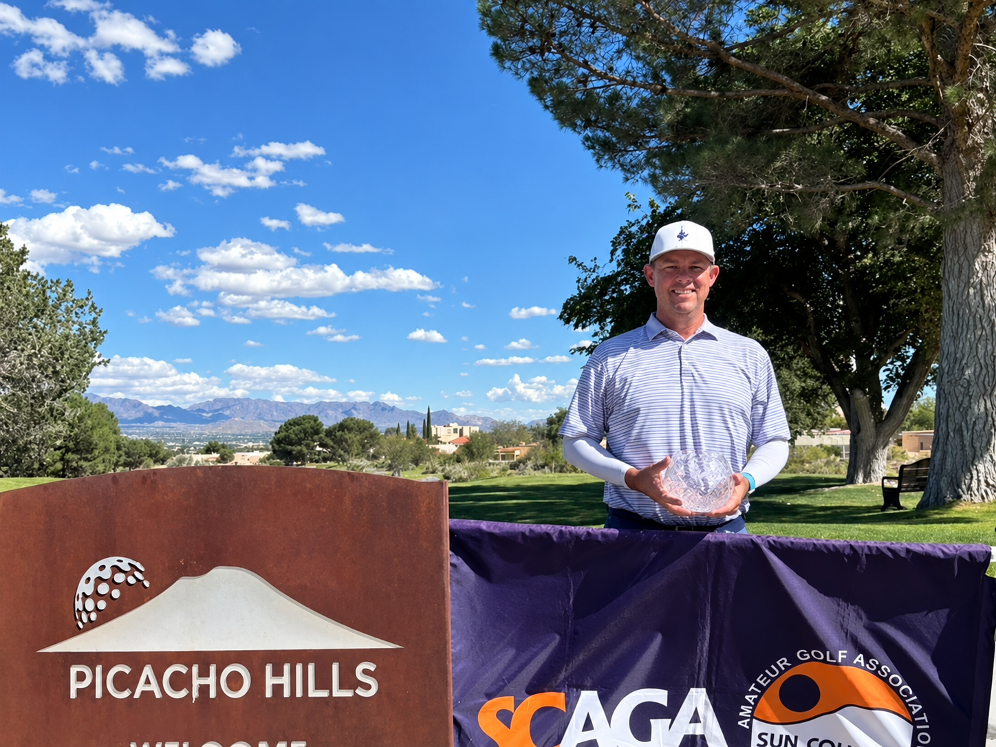 Scott Lieberwirth of El Paso holds the Men's Championship trophy at Picacho Hills Country Club.